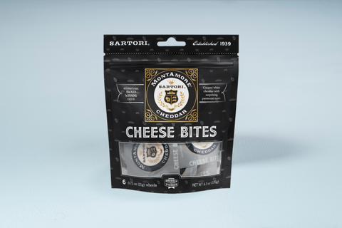 Sartori MontAmore Cheddar cheese bites packaging on a light blue background